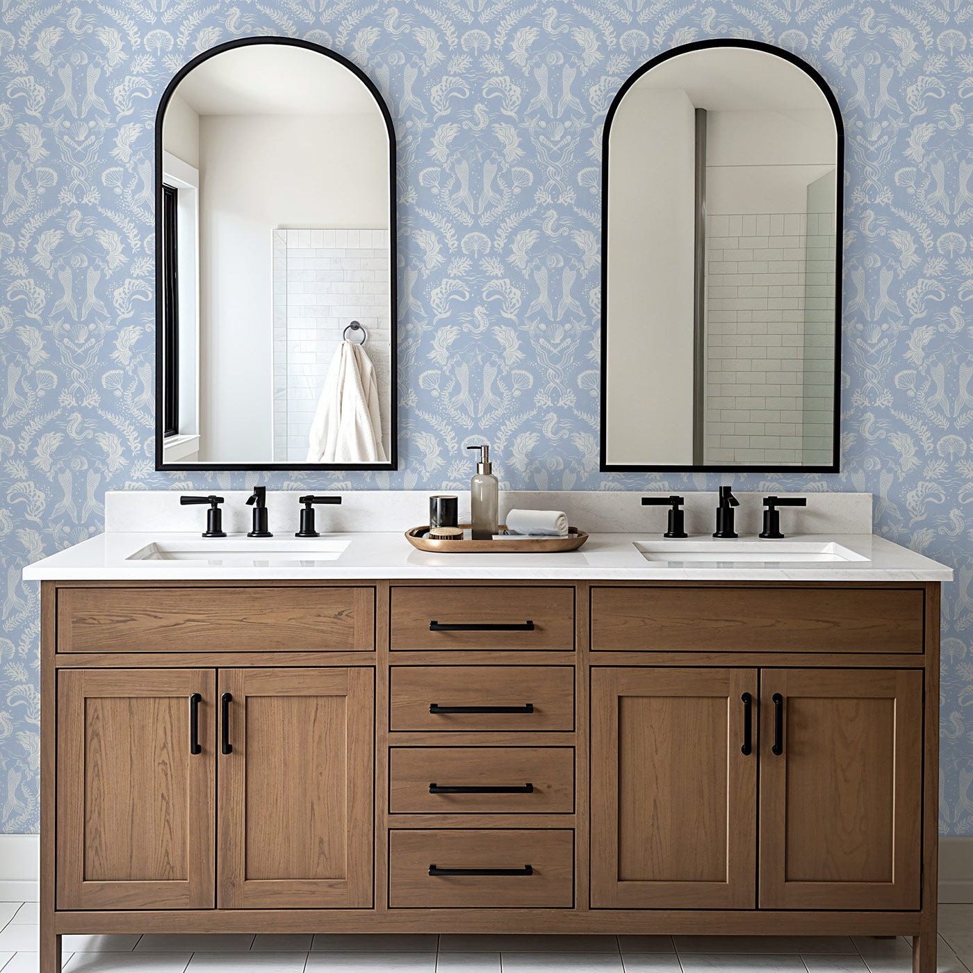 A stunning coastal blue wallpaper with a Dreamy Mermaid motif in a modern double vanity bathroom