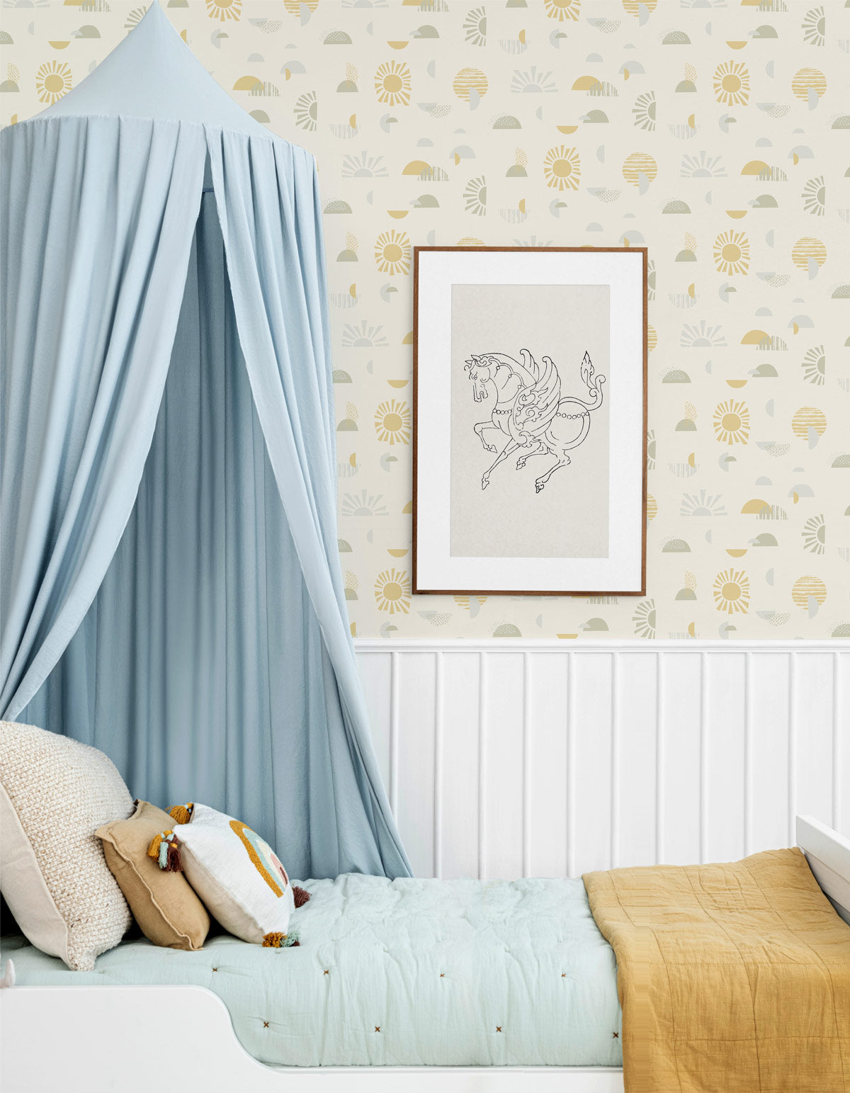 Mid-century, modern, sun-shapes wallpaper, in soft yellows and greens on a creamy off-white background, balances in perfect harmony in this kids room.