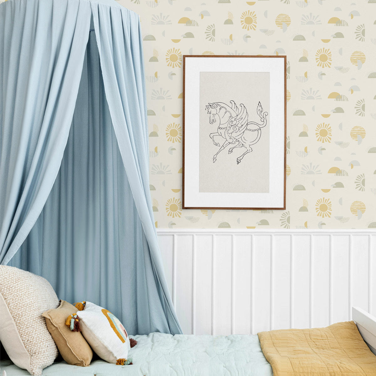 Mid-century, modern, sun-shapes wallpaper, in soft yellows and greens on a creamy off-white background, balances in perfect harmony in this kids room.