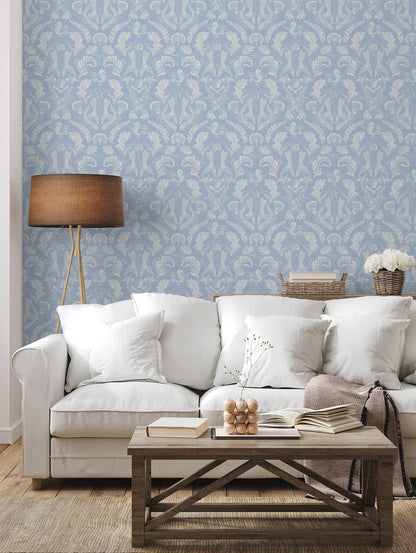 A stunning Dreamy Mermaid wallpaper in a soft blue color palette in a beautiful coastal living room.