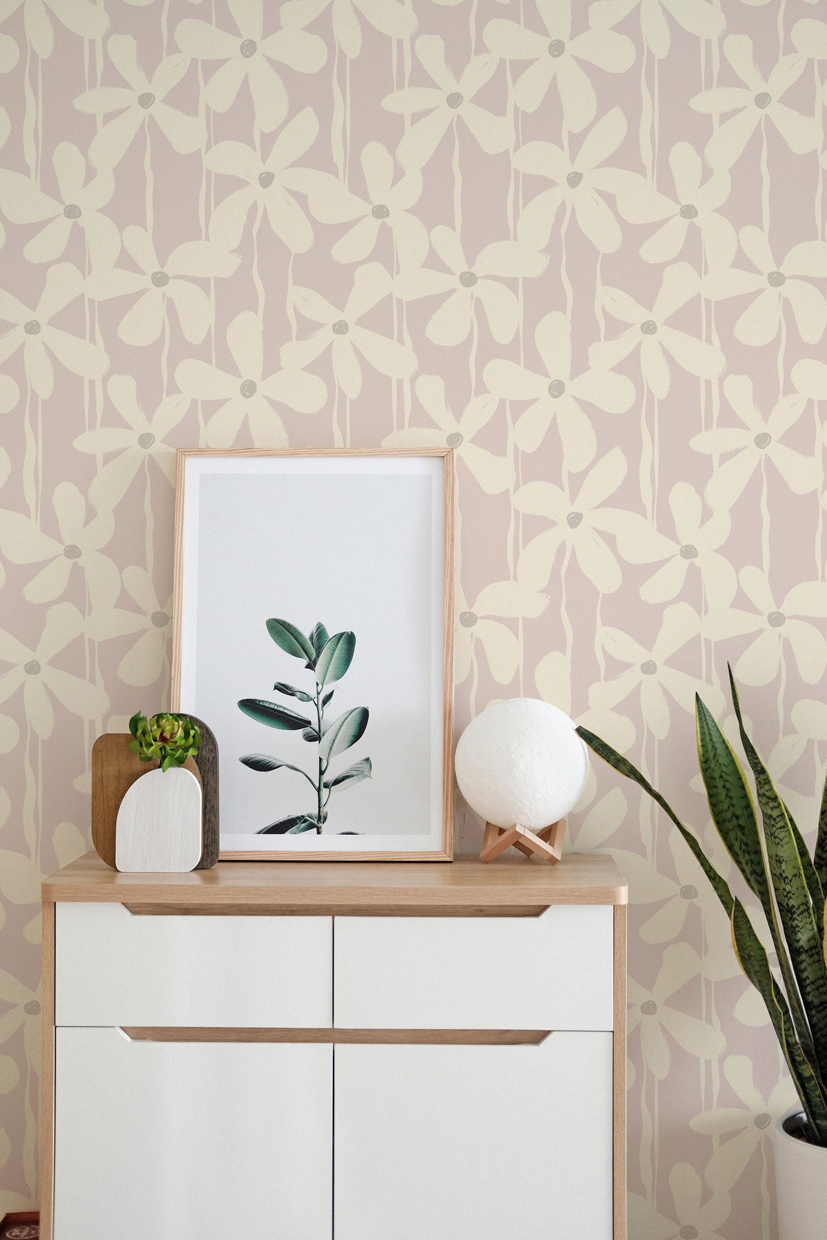A bold floral wallpaper in a soft pink palette adds a modern flair to this bedroom accent wall.