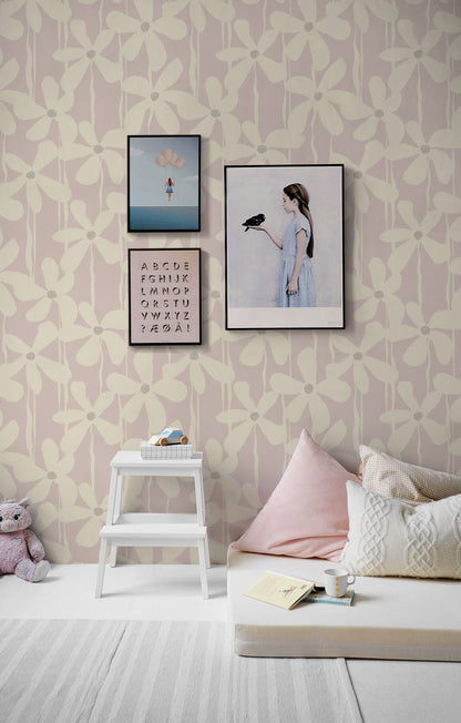 A graphic brushstroke floral wallpaper in a soft pink nursery room adds a calming feminine touch.
