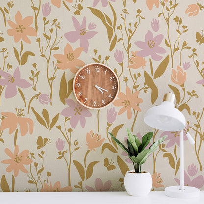Floral wallpaper with a wooden clock and white lamp on a table.