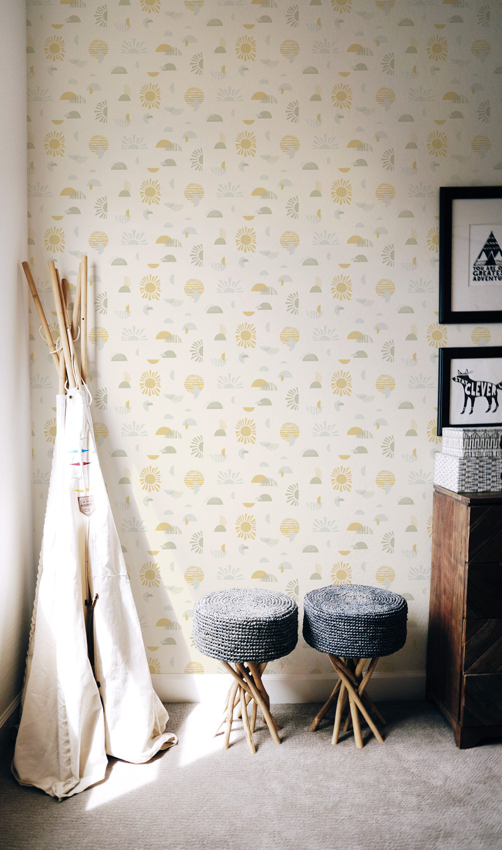 Mid-century, modern, sun-shapes  wallpaper, in soft yellows and greens on a creamy off-white background, balances in perfect harmony in this kids room.